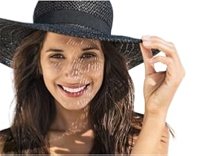 Smiling woman in sunhat, suggesting sun protection.