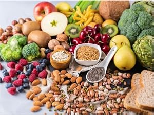 Assorted healthy foods rich in biotin, nuts, seeds, fruits, and veggies.